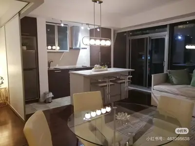 a kitchen and living room with a glass table at xto in Markham
