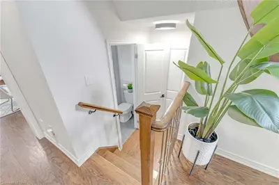 a staircase with a potted plant in a room at Tranquil Haven near Niagara in Thorold