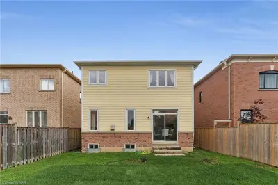 a house with a fence in a yard at Tranquil Haven near Niagara in Thorold