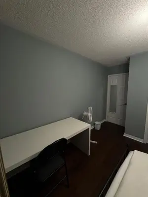 a room with a white desk and a bed at Gorgeous Private room in Toronto