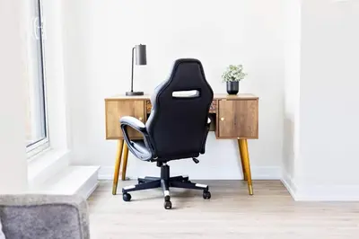 a black office chair sitting in front of a desk at Spacious 3-BDR Home with Incredible View with parking in Toronto