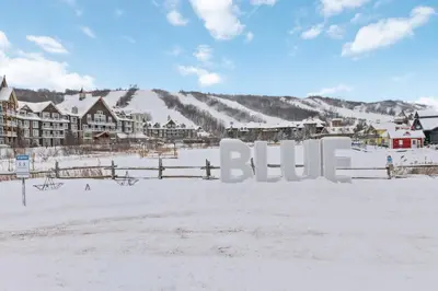 a resort in the snow with the word blue at 109 North Creek in Blue Mountains