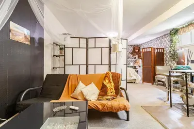 a living room with a couch and a table at Studio Apartment in Casa, semi-bsmt in Toronto