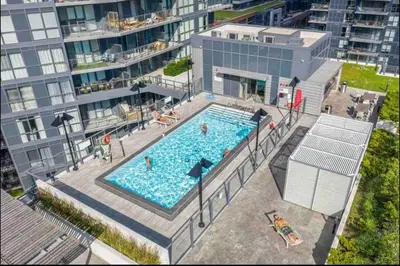 an overhead view of a swimming pool in a building at Hidden gem in Humber bay shores Toronto with parking in Toronto