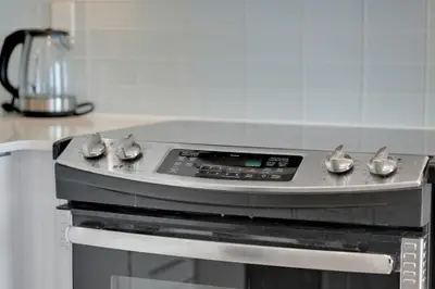 a stove top oven in a kitchen at Tranquil Lakeside Suite Toronto in Toronto