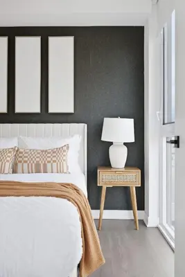 a bedroom with a bed and a table with a lamp at Modern 3BR Condo Sleeps 8 with Floor-to-Ceiling Views in Toronto