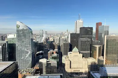 a view of a large city with tall buildings at 60th Floor Luxury SkySuite 3BD Lake & City Views in Toronto