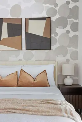 a bedroom with a bed with three pictures on the wall at Modern West Getaway 2BR Condo with Free Parking in Toronto