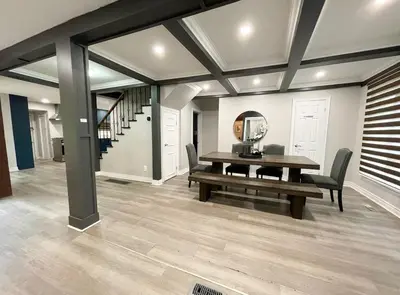 a dining room with a table and a mirror at Cottage getaway in the city, for intimate family gathering in Ajax