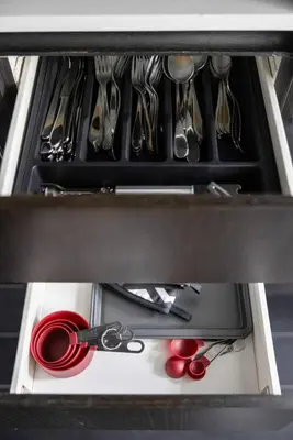 a drawer with utensils and scissors in it at Modern 4BR Home Sleeps 12 Steps to CN Tower in Toronto