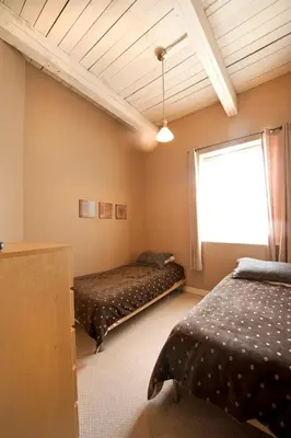 a bedroom with two beds and a window at SUPERIOR 3 in Niagara Falls
