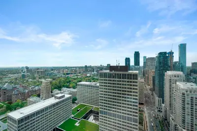 an aerial view of a city with tall buildings at 1 Bedroom Condo Burano Downtown Toronto in Toronto