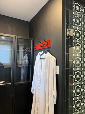a bathroom with a towel hanging on a rack at 1Br Apt In Mansion With Indoor Pool Hot Tub in Hamilton