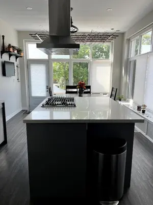 a kitchen with a white counter top and a stove at 1Br Apt In Mansion With Indoor Pool Hot Tub in Hamilton