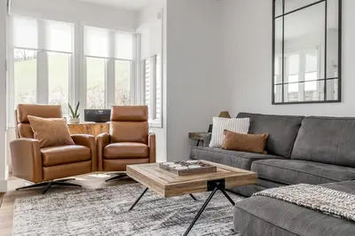 a living room with a couch and chairs and a table at Lift Side Luxury Newly renovated walk to village in Blue Mountains