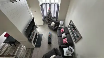 an overhead view of a living room with a christmas tree at Slopeside Haven - Ski-In Ski-Out Adventure Base in Blue Mountains