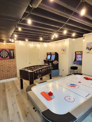 a room with a ping pong table and a ping pong game at Large 4 Br - 5 Bathroom with Heated Pool 2 King beds Sauna Pool Table in Blue Mountains