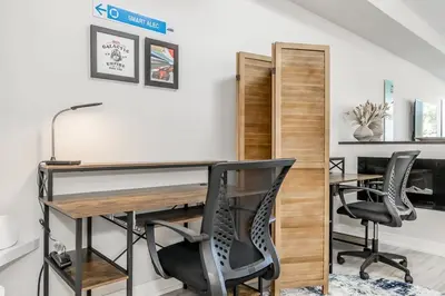 an office with a desk and two chairs at Family Townhouse Walk-Shuttle to Blue Fire Pit in Blue Mountains