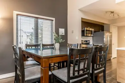 a dining room and kitchen with a table and chairs at Mountain Walk Retreat - Walk to Blue Patio area in Blue Mountains