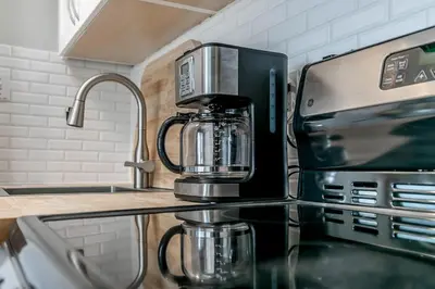 a coffee maker sitting on top of a kitchen counter at Wanderer Way Loft Ski-In Ski-Out - Pool & Hot Tub in Blue Mountains