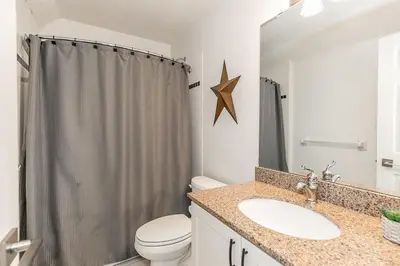 a bathroom with a toilet and a sink and a shower at Mountain Peaks Ski-In-Out Pool Shuttle in Blue Mountains