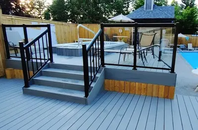 a deck with stairs next to a swimming pool at Arrowhead Retreat Ski-In-Out Pool Shuttle in Blue Mountains