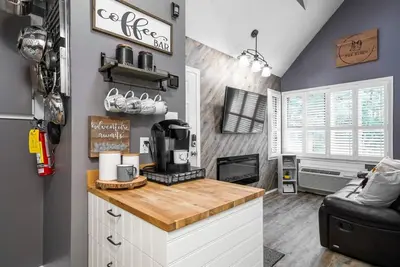 a kitchen with a counter with a coffee maker on it at Fox Ridge - Ski-In-Out Pool Hot Tub Shuttle in Blue Mountains