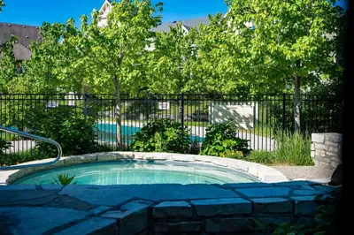 a small pool in front of a fence with trees at Hickory Ridge Across Blue Mtn Hot Tub Shuttle in Blue Mountains