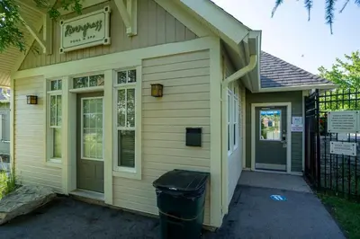 a building with a trash can in front of it at Three Suns Across Blue Mtn Hot Tub & Shuttle in Blue Mountains