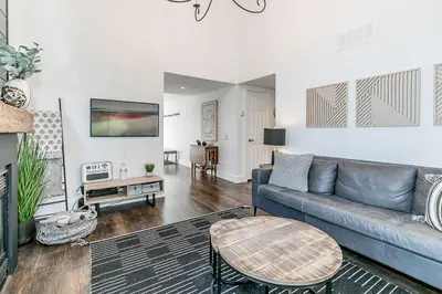 a living room with a couch and a table at Hip Hideaway - Family Fun Walk to the Village in Blue Mountains