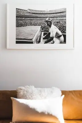 a black and white photo of a man sitting on a couch at Sierra Summit - Walk to the Village family fun in Blue Mountains