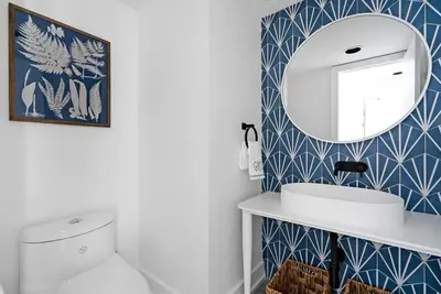 a bathroom with a white toilet and a mirror at View to Blue - Walk to the Village Mountain Views in Blue Mountains