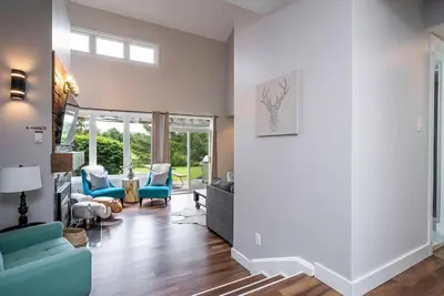 a living room with a blue couch and chairs at Memory Lane - Walk to the Village - Sleeps 10 in Blue Mountains