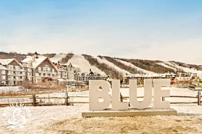 a sign that says bilo in the snow at Slopeside Loft at North Creek Resort in Blue Mountains