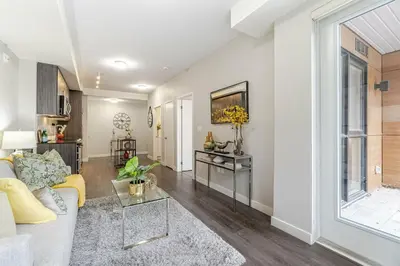 a living room with a couch and a table at 1 BR Boutique Charm, Urban Calm! in Oakville