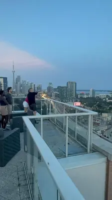 a group of people standing on top of a building at Central Downtown New Year Stay- Self Checkin & Free Wifi in Toronto