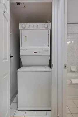 a kitchen with a white stove and a refrigerator at Tropical Designer King Suite - Sleeps 5 - Parking in Mississauga