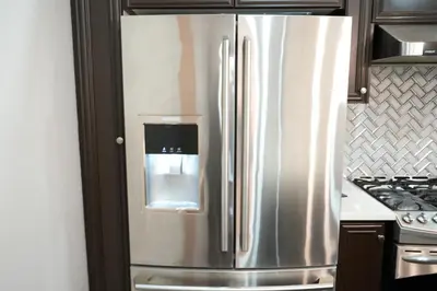 a stainless steel refrigerator with a water dispenser on it at Luxury 5BR Home with Spa Bath in Burlington