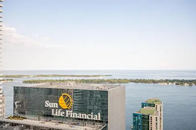 a building with the suntec financial logo on it at Lake view Studio Condo High Floor Downtown Toronto in Toronto