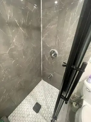 a bathroom with a shower with a toilet at Cost Effective Stay in Core Downtown Queen-King St-Self Checkin & Free Wifi in Toronto