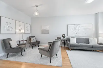 a living room with a couch and chairs and a table at Spacious Toronto Home Near High Park and Yorkdale Mall in Toronto