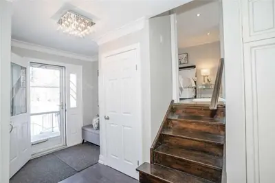 a hallway with a stairway leading to a bedroom at Beautiful 3 bed 2 bathroom home Toronto in Toronto