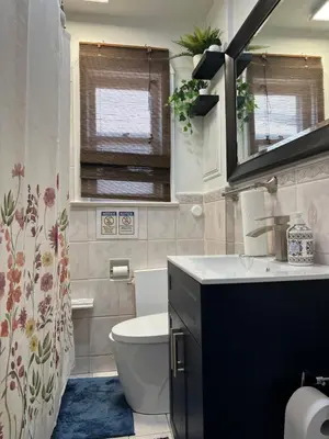 a bathroom with a toilet and a sink at Private Room with Shared Bathroom in West-Toronto in Toronto