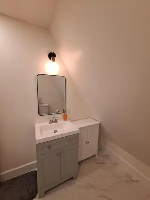 a bathroom with a sink and a mirror on the wall at Elderado A-Frame