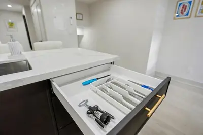 a kitchen with a drawer with a wrench in it at The Wynford Romantic Amalfi Escape in Elora