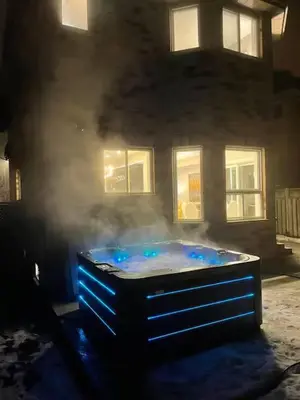 a hot tub with smoke in front of a building at Navigate Stays Canada Luxury Hot Tub Retreat Home in Richmond Hill