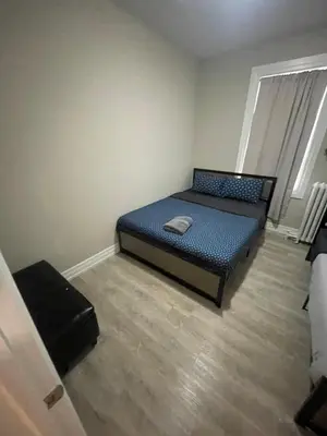 a small bedroom with a bed in a room at DOWNTOWN STAY-Free Wifi&Self Checkin in Toronto