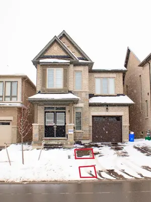 a house with a no parking sign in the snow at Oshawa Two Bedroom Private Suite in Oshawa
