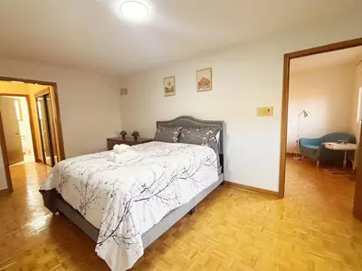 a bedroom with a bed and a mirror at Relocation Ready- Pet-Friendly 4BR-Core of transit in Vaughan