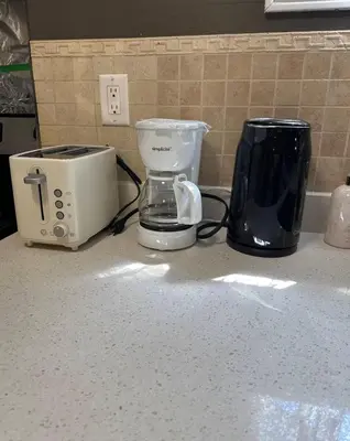 a kitchen counter with a toaster and a blender on it at Comfortable Basement Private Room with Ensuite Near Plaza in Richmond Hill